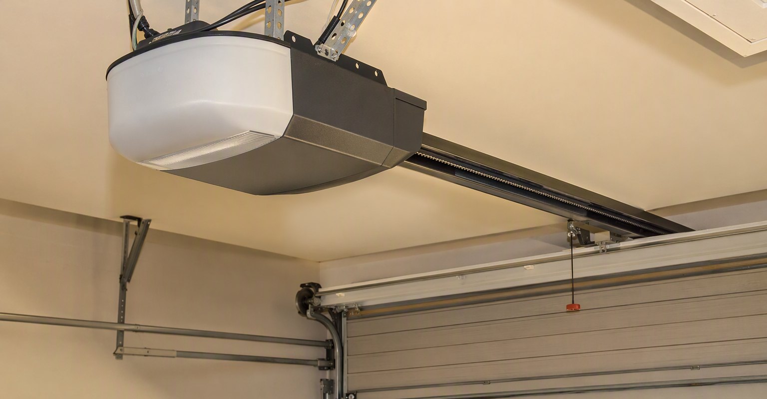 Belt-drive garage door opener on a garage ceiling